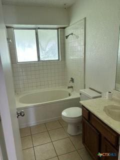 full bathroom with tile patterned floors, toilet, vanity, and tiled shower / bath