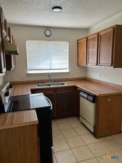 kitchen featuring dishwasher, a textured ceiling, range with electric cooktop, and sink