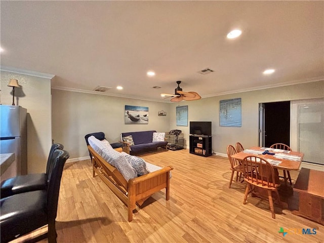 1306 W Madison Ave, Port Oconnor, TX 77982 - living room with crown molding, a ceiling fan, light wood-style floors, baseboards, and recessed lighting