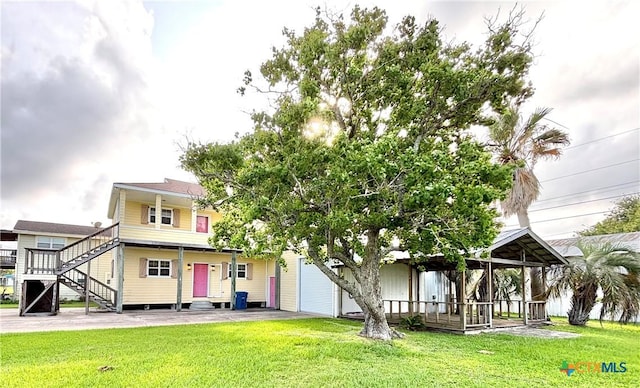 1306 W Madison Ave, Port Oconnor, TX 77982 - view of front of property featuring a front yard and a gazebo
