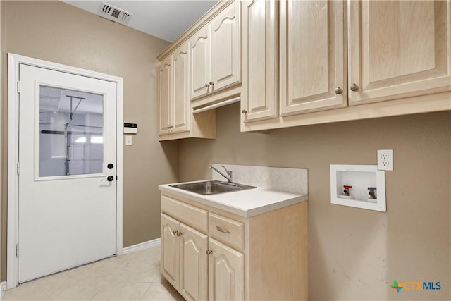 110 Agua Verde, Seguin, TX 78155 - washroom with washer hookup, cabinet space, baseboards, and light tile patterned floors
