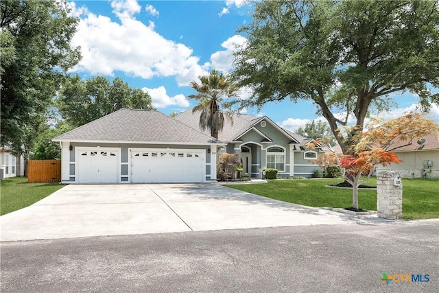 110 Agua Verde, Seguin, TX 78155 - ranch-style house featuring concrete driveway, an attached garage, roof with shingles, and stucco siding