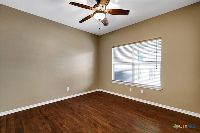 110 Agua Verde, Seguin, TX 78155 - spare room with baseboards, dark wood-style flooring, and a ceiling fan