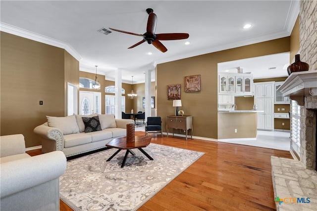 110 Agua Verde, Seguin, TX 78155 - living area featuring a chandelier, ceiling fan, ornamental molding, light wood-style flooring, and recessed lighting