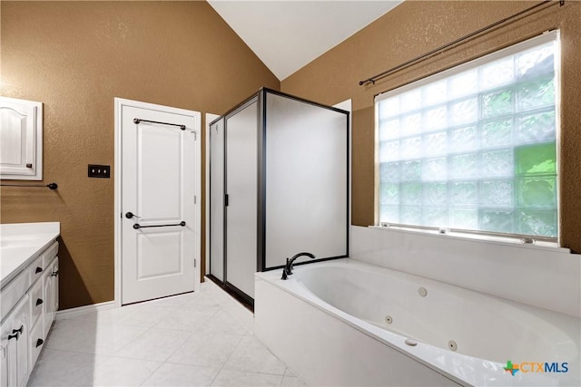 110 Agua Verde, Seguin, TX 78155 - full bathroom featuring a textured wall, a stall shower, a whirlpool tub, vanity, and tile patterned flooring