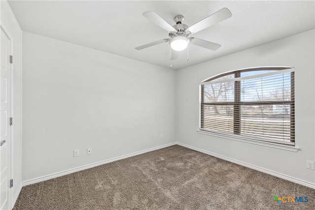 carpeted empty room with ceiling fan