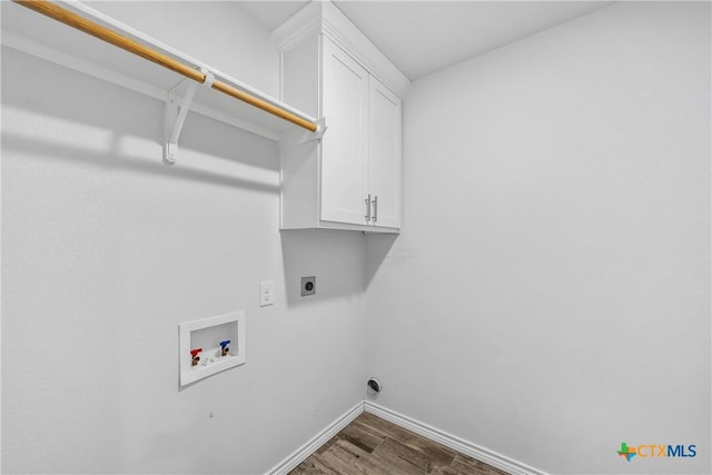 laundry area with cabinets, washer hookup, hardwood / wood-style floors, and electric dryer hookup