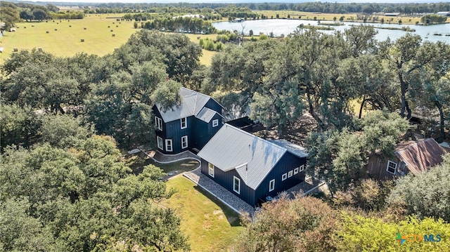 birds eye view of property featuring a water view and a rural view