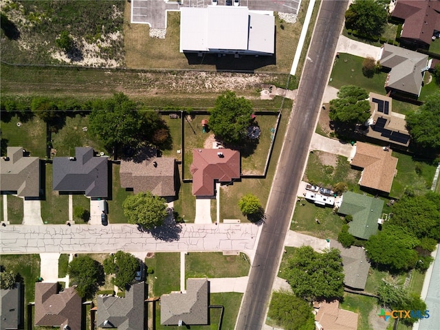aerial overview of property's location with nearby suburban area