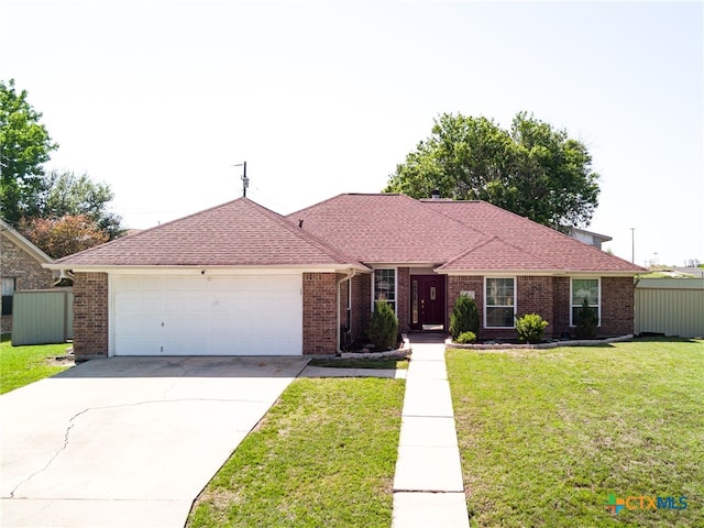 ranch-style home featuring an attached garage, brick siding, concrete driveway, and a shingled roof