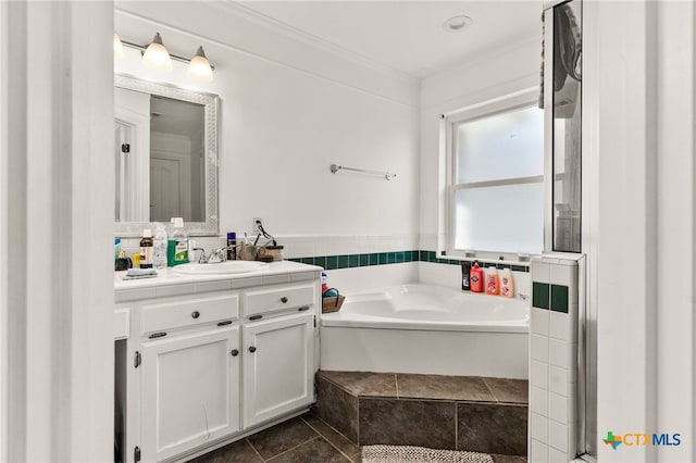 full bath featuring vanity, a bath, and ornamental molding