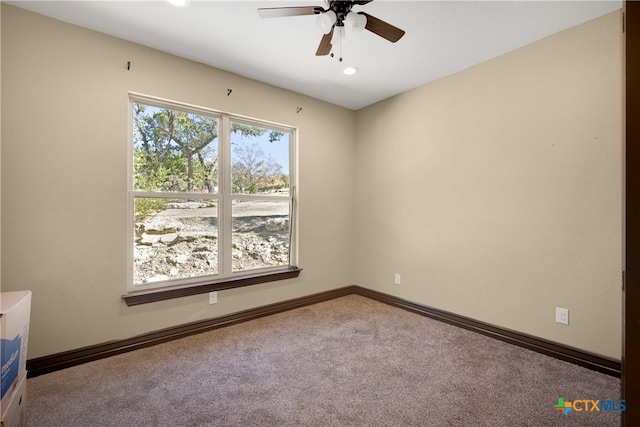 carpeted empty room with ceiling fan