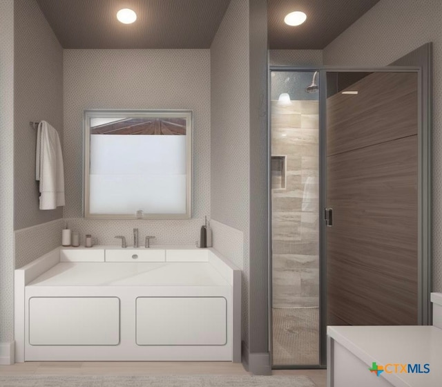 bathroom with a shower with door