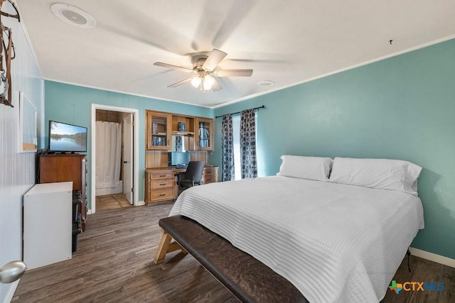 bedroom with ceiling fan, dark wood-type flooring, and ornamental molding