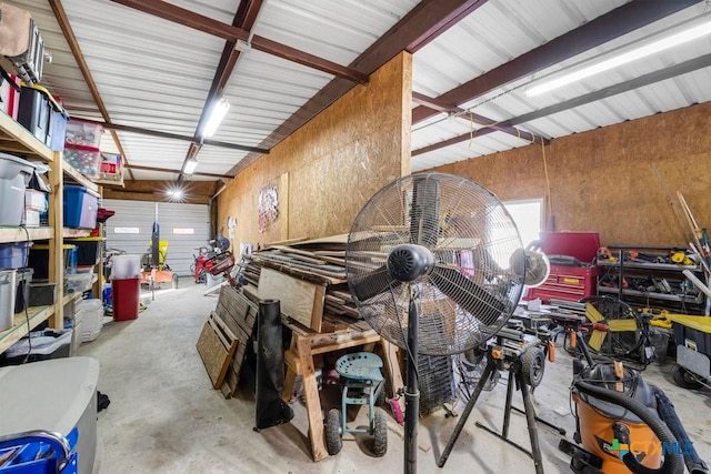 garage featuring wooden walls