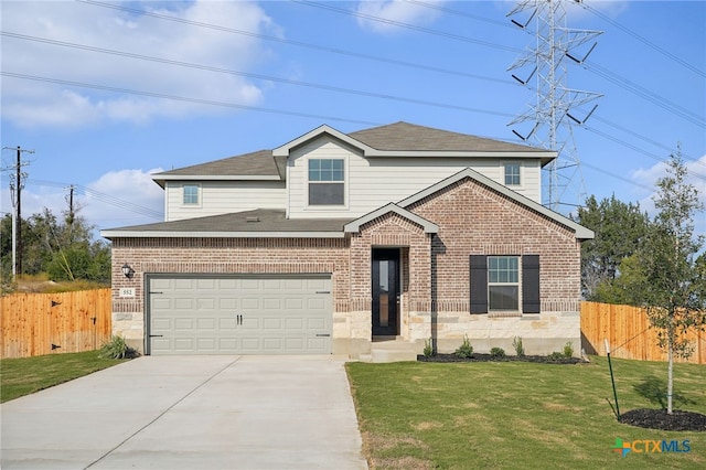 view of front of house featuring a front yard and a garage