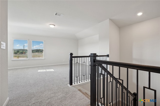 corridor featuring carpet flooring