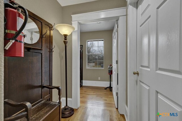 608 S Guadalupe St, San Marcos, TX 78666 - corridor with light wood-type flooring and baseboards