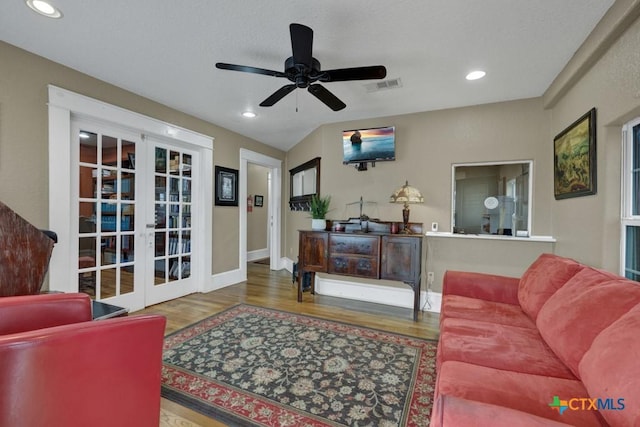 608 S Guadalupe St, San Marcos, TX 78666 - living area with french doors, wood finished floors, a ceiling fan, and recessed lighting