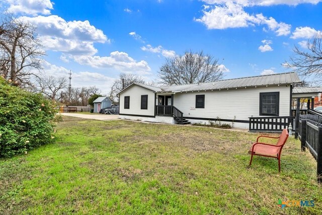 608 S Guadalupe St, San Marcos, TX 78666 - rear view of property with a metal roof