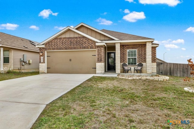 view of front of property with driveway, fence, board and batten siding, an attached garage, and brick siding