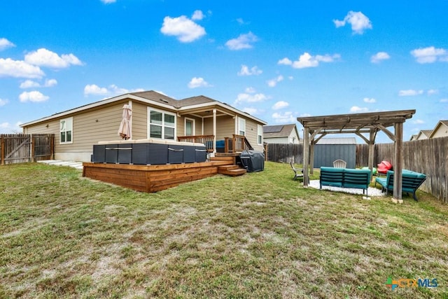 back of property with a lawn, a wooden deck, a fenced backyard, and a pergola