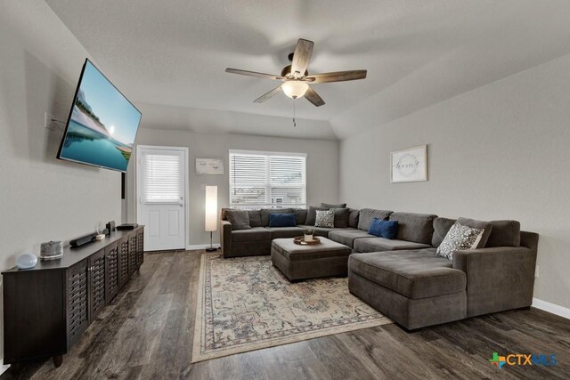 living area with ceiling fan, baseboards, and wood finished floors