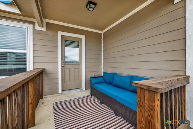 property entrance with an outdoor living space