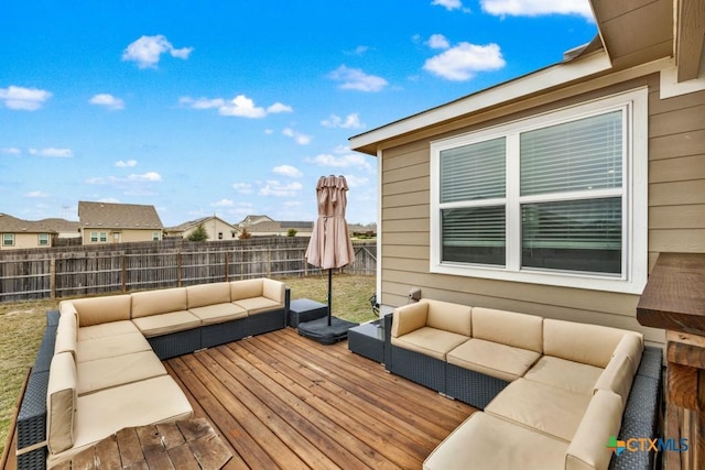 deck with an outdoor living space and fence