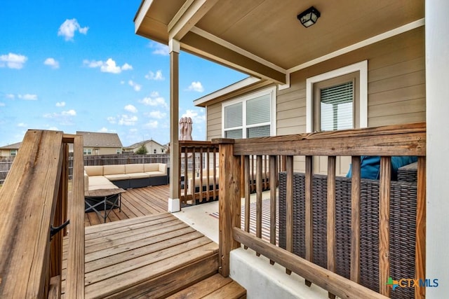 wooden deck featuring outdoor lounge area