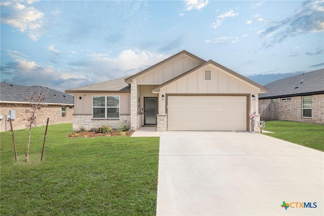 view of front facade with an attached garage, board and batten siding, a front yard, stone siding, and driveway