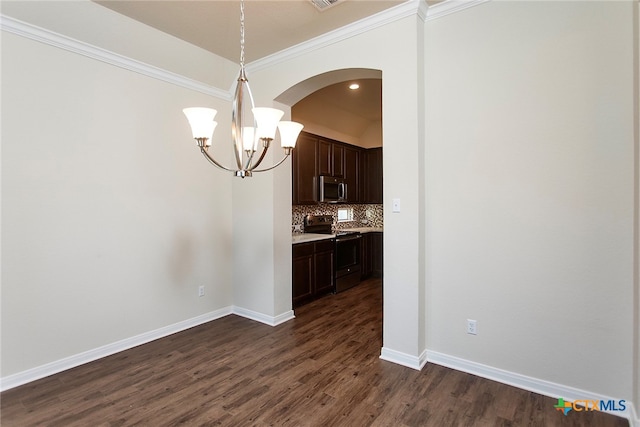 unfurnished dining area featuring dark hardwood / wood-style flooring and ornamental molding