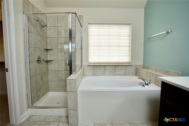 bathroom with vanity, plus walk in shower, and tile patterned flooring