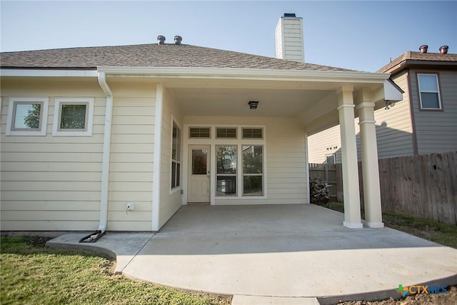 7841 Old Gate Rd, Temple, TX 76502 - back of house featuring a patio area, a chimney, and a shingled roof