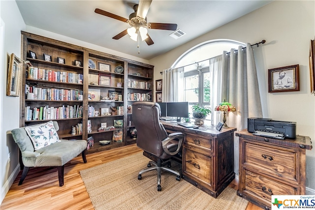 home office with ceiling fan and light wood-type flooring