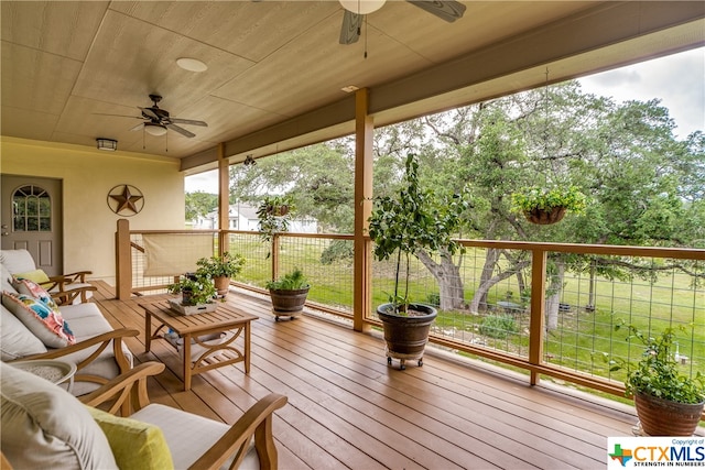 wooden deck with ceiling fan