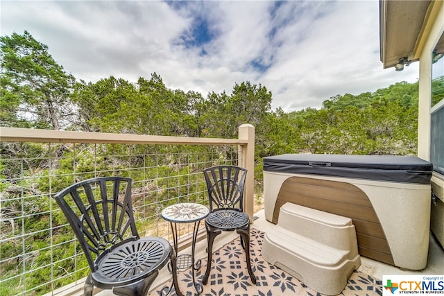 balcony with a hot tub