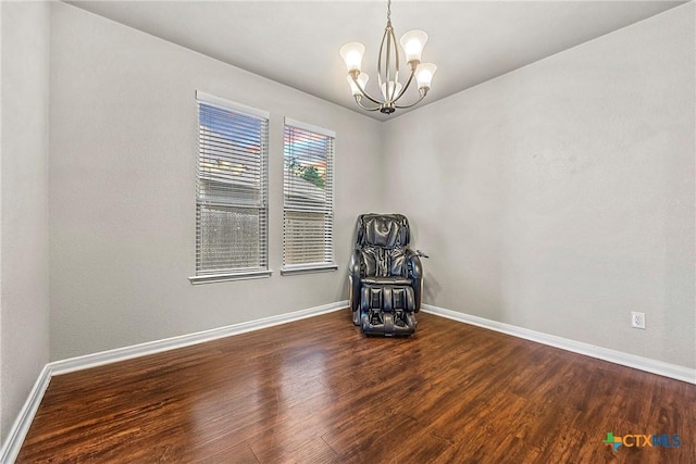 606 Hobby Rd, Copperas Cove, TX 76522 - unfurnished room with a chandelier, wood finished floors, and baseboards