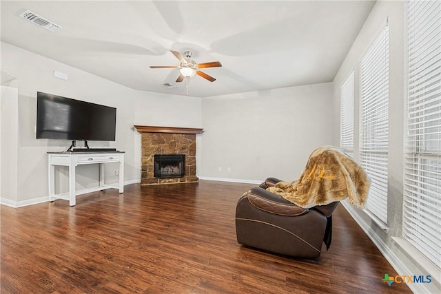 606 Hobby Rd, Copperas Cove, TX 76522 - living room with a ceiling fan, wood finished floors, baseboards, and a stone fireplace