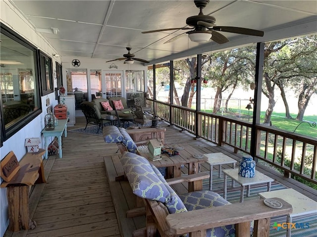 deck featuring outdoor dining area and ceiling fan