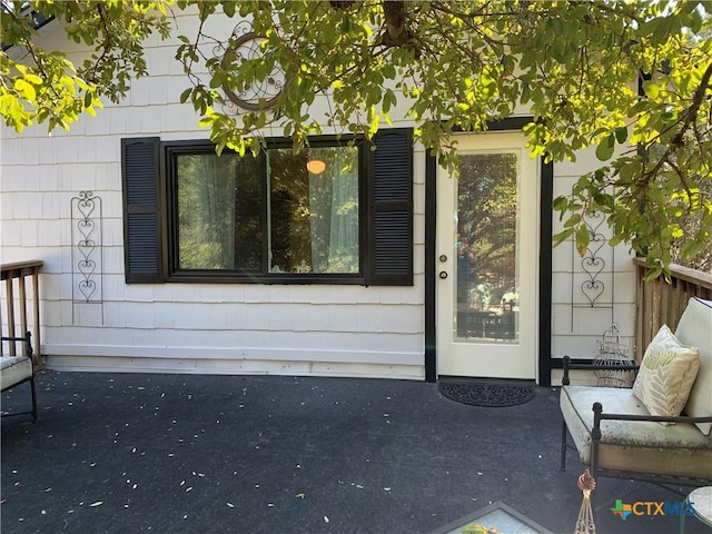 doorway to property with a patio area