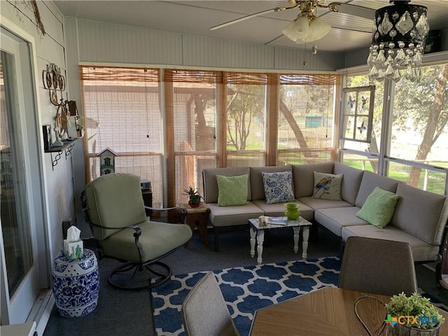 sunroom featuring ceiling fan