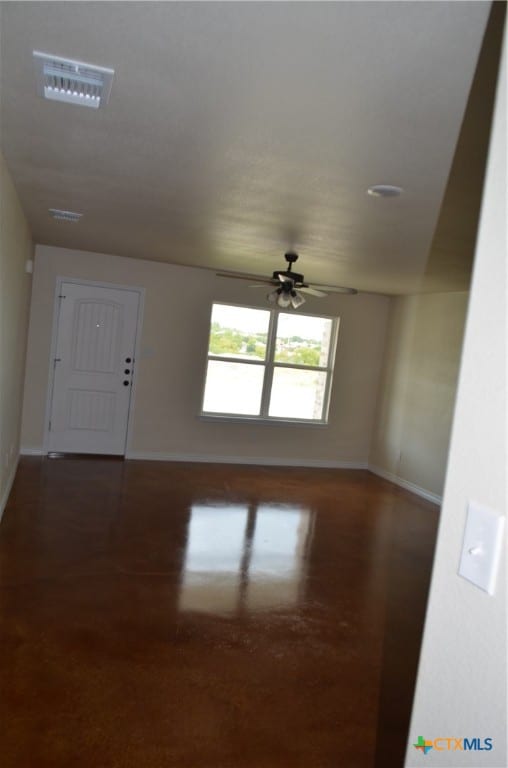 interior space with dark hardwood / wood-style flooring and ceiling fan