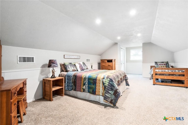 carpeted bedroom featuring visible vents and lofted ceiling