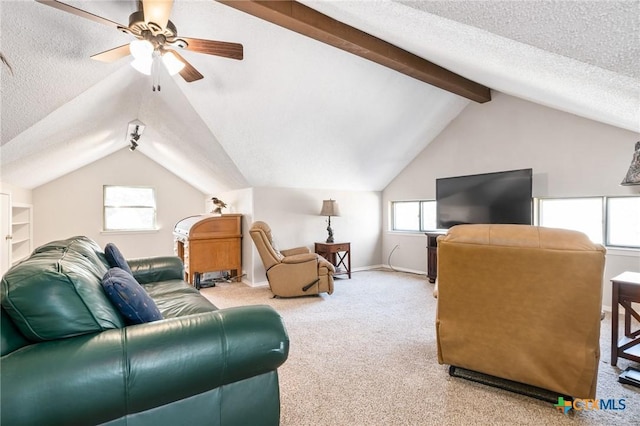 living room with vaulted ceiling with beams, baseboards, carpet flooring, a textured ceiling, and a ceiling fan