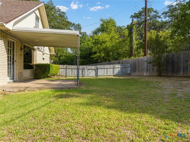 view of yard with a patio area and a fenced backyard