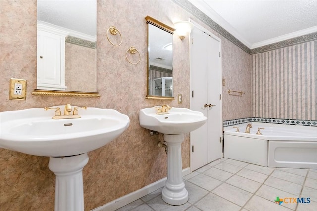 full bath featuring tile patterned flooring, wallpapered walls, baseboards, ornamental molding, and a bath