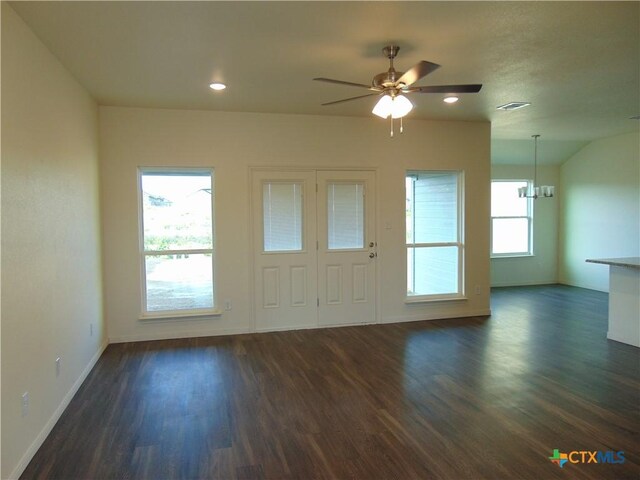 3101 Salt Fork Dr, Killeen, TX 76549 - kitchen featuring a sink, dark wood finished floors, light stone counters, brown cabinets, and a kitchen island with sink