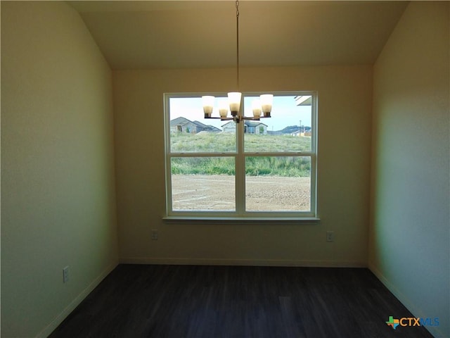 3101 Salt Fork Dr, Killeen, TX 76549 - unfurnished dining area featuring a chandelier, dark wood-style flooring, healthy amount of natural light, and baseboards