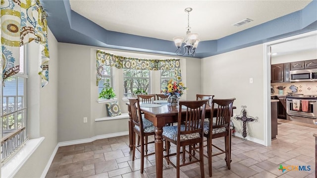 689 Abels Way, Canyon Lake, TX 78133 - dining area with stone tile floors and a chandelier